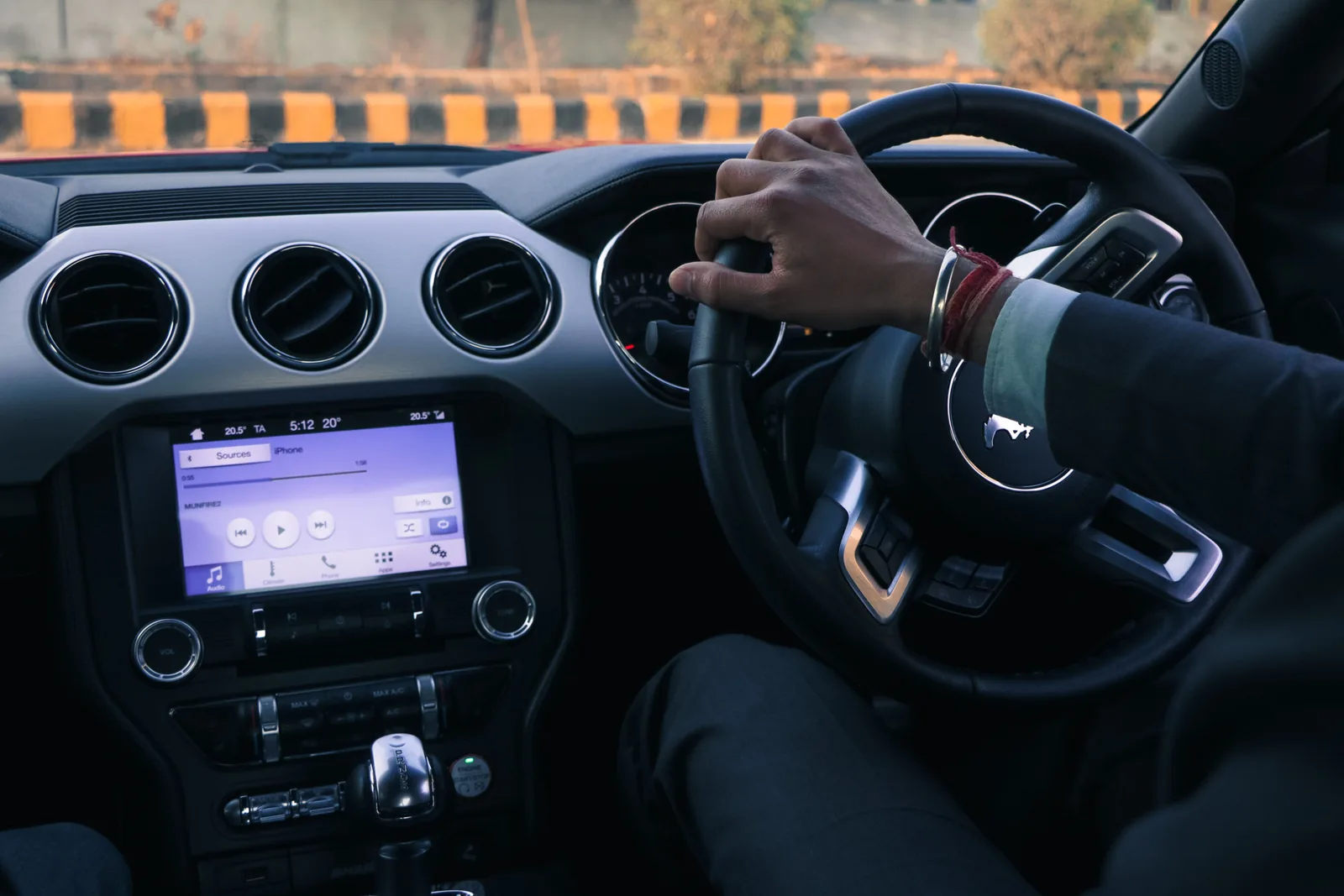 Driver holding steering wheel in Delhi